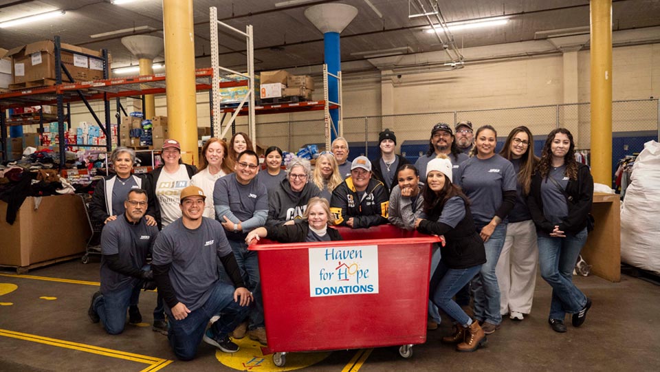 HOLT CAT team members volunteering at Haven for Hope Share the Warmth donation drive